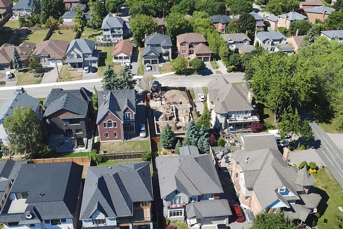 Modern custom house project site view with foundation completed.