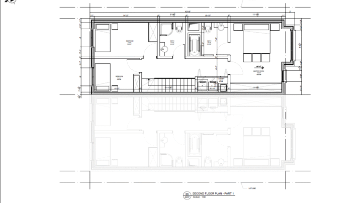 Second floor plan showing three bedrooms, bathrooms, and laundry area