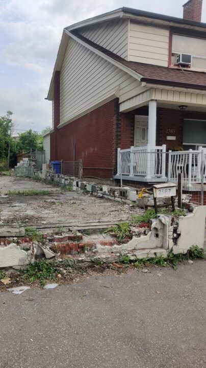 Rear lot view showing existing trees and grading before development