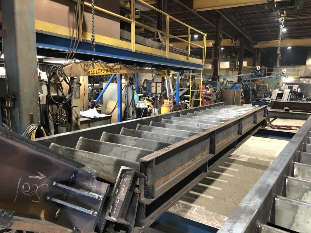 Steel feature staircase stringers being fabricated in a shop