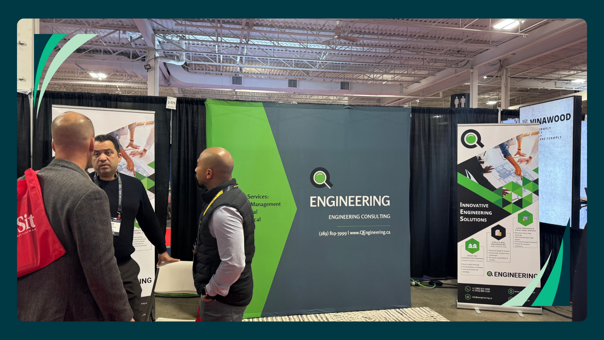 Visitors talking with Q Engineering staff at the Canadian Concrete Expo