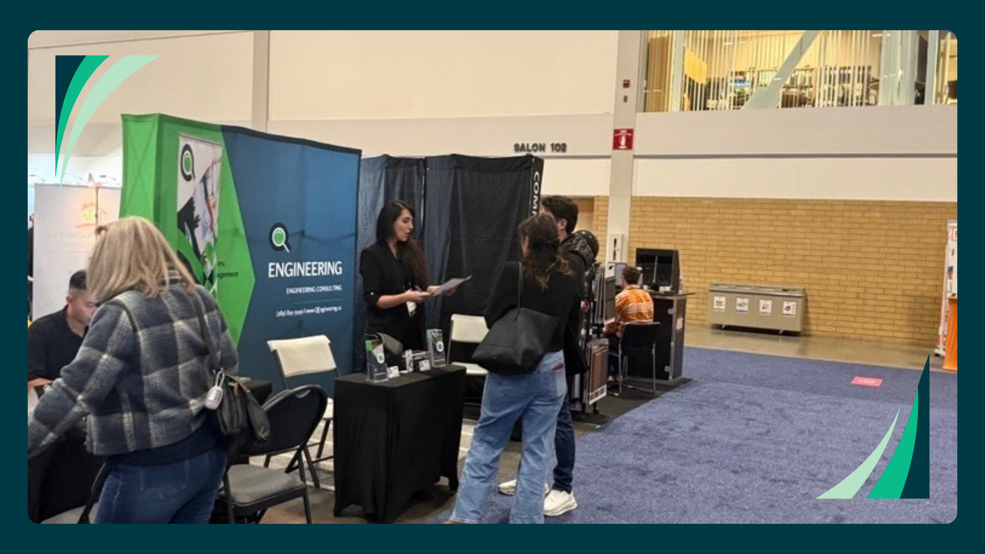 Visitors at the Q Engineering booth during a home show in Toronto