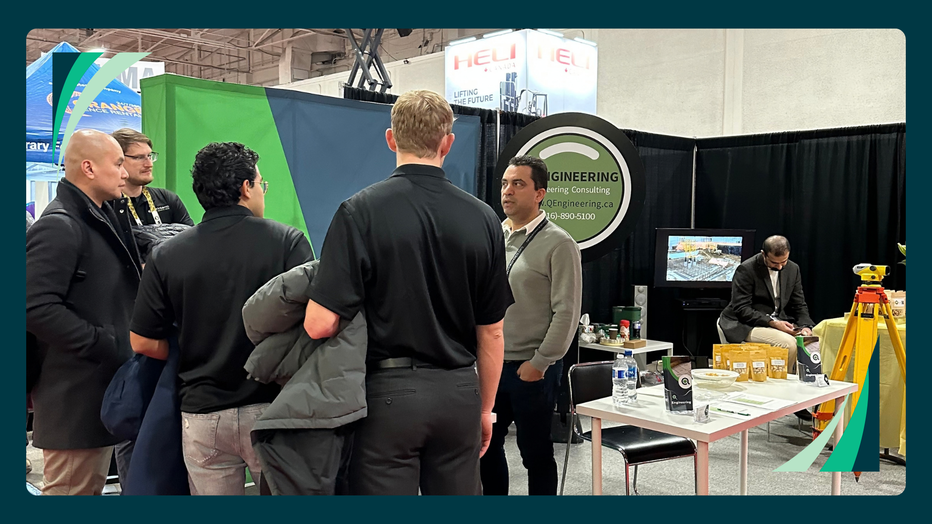 Group of visitors at the Q Engineering booth, Canadian Concrete Expo